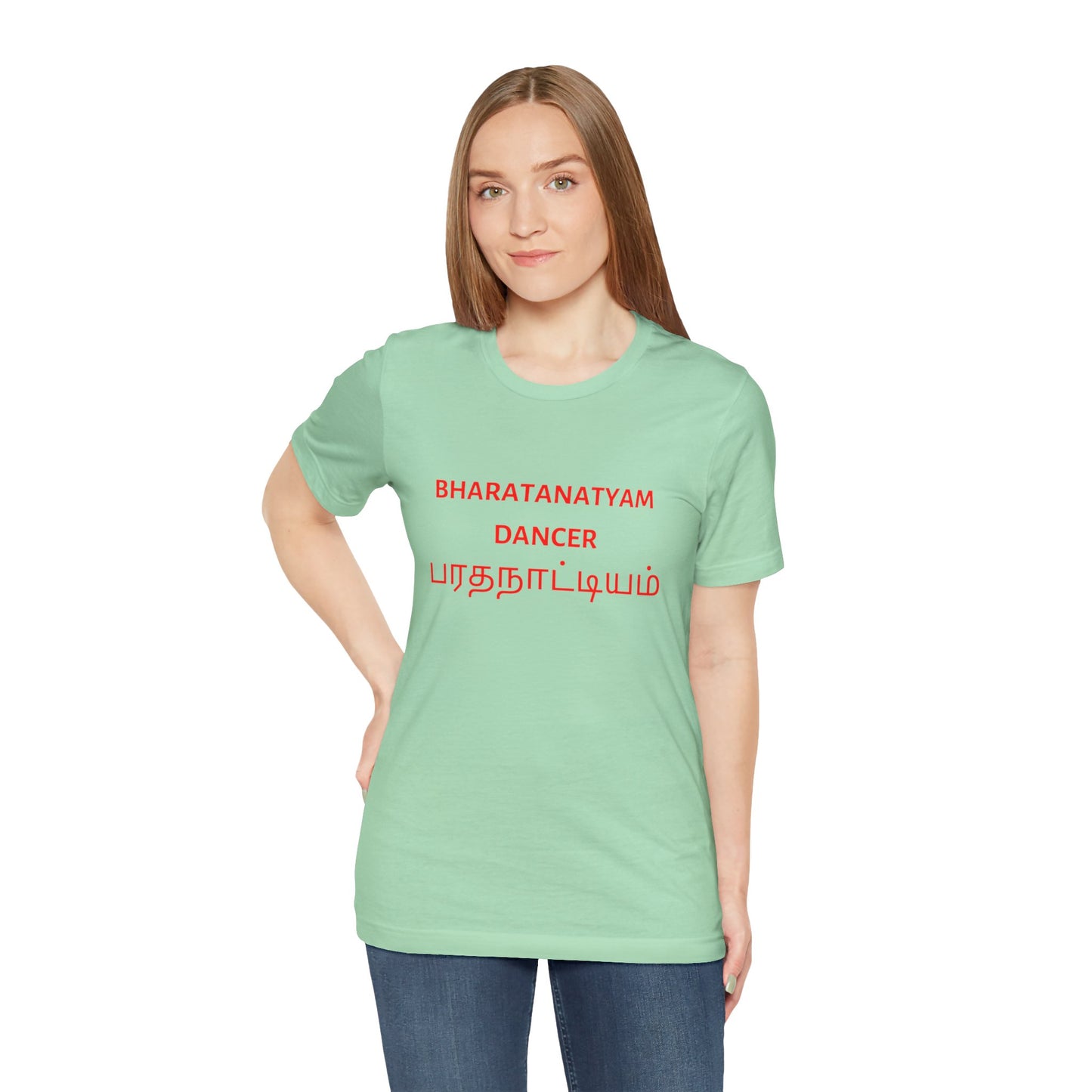 a woman wearing a mint shirt that says bharatanatyam dancer with bharatanatyam written in Tamil
