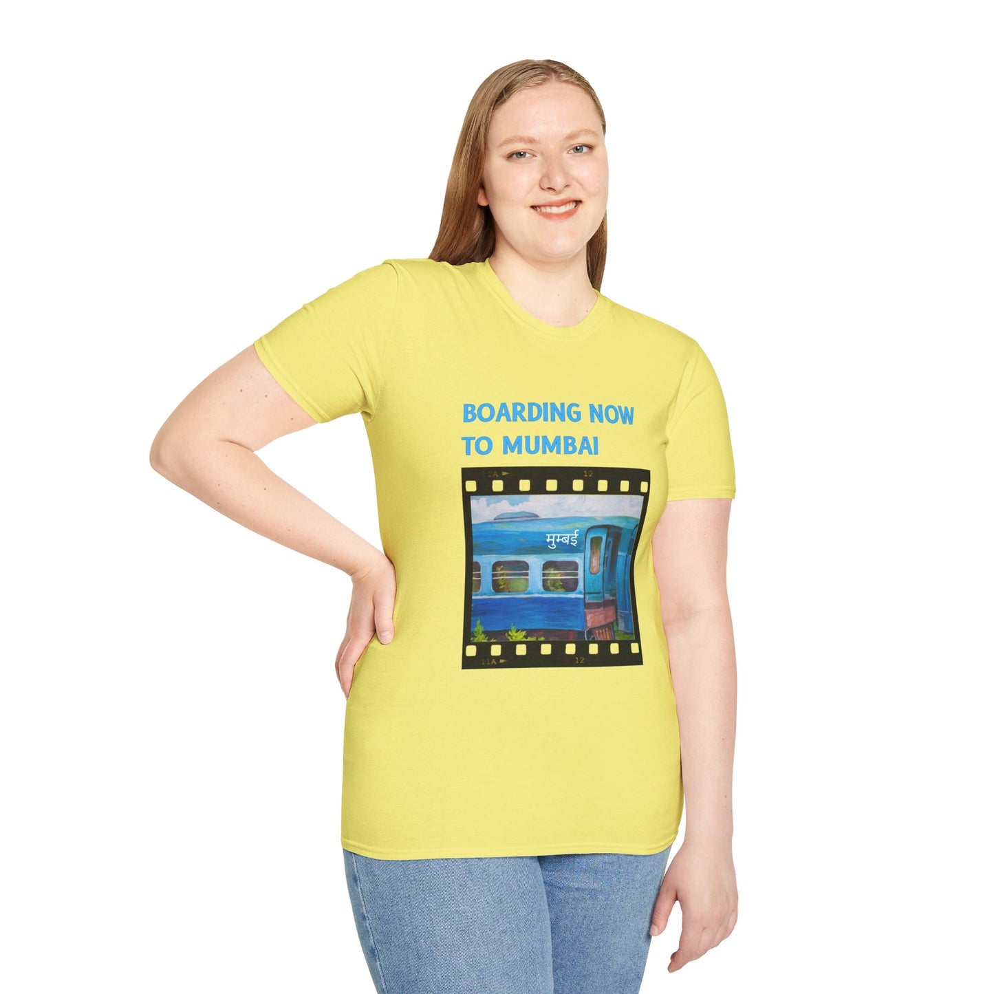 a woman wearing a cornsilk yellow shirt that says boarding now to mumbai with a graphic of a train