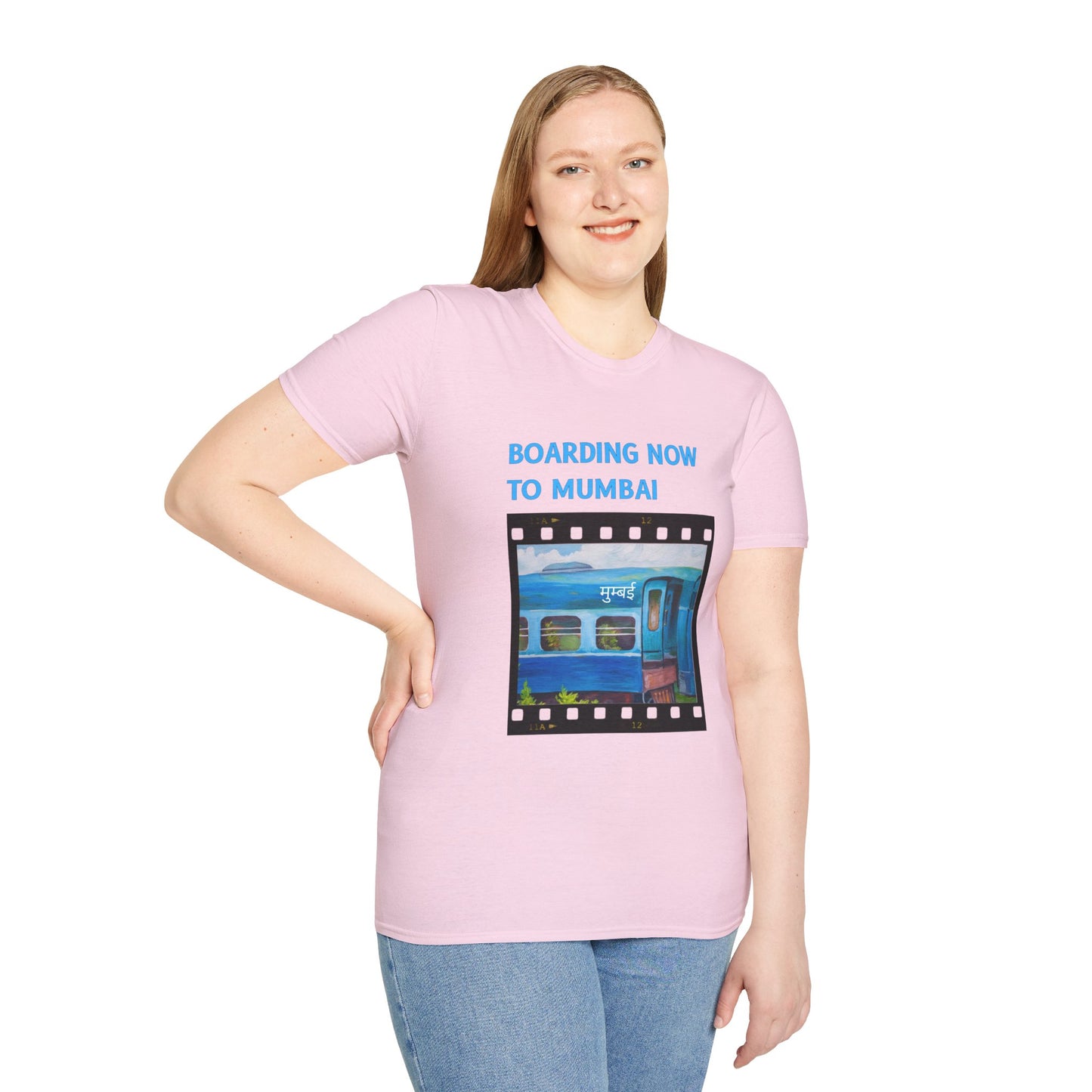 a woman wearing a light pink shirt that says boarding now to mumbai with a graphic of a train