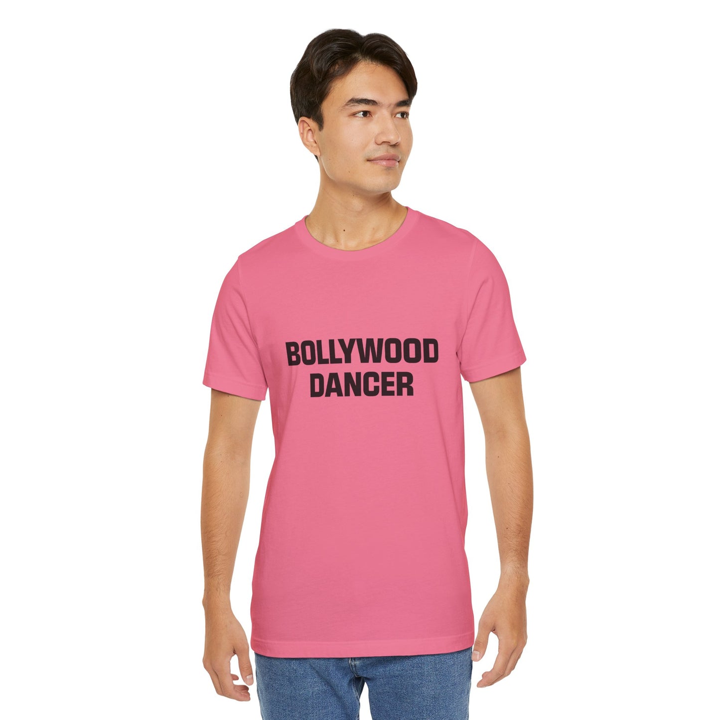 a man wearing a charity pink shirt that says bollywood dancer