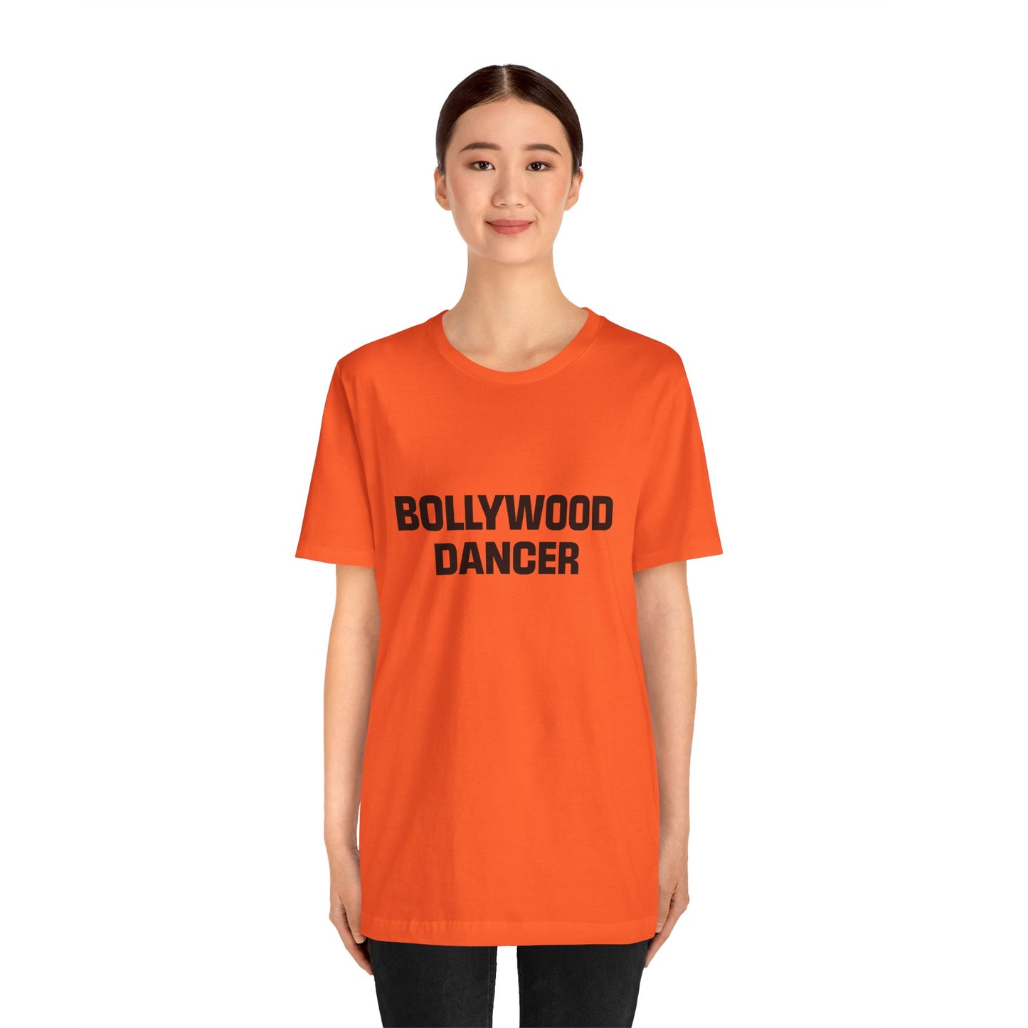 a woman wearing a orange shirt that says bollywood dancer