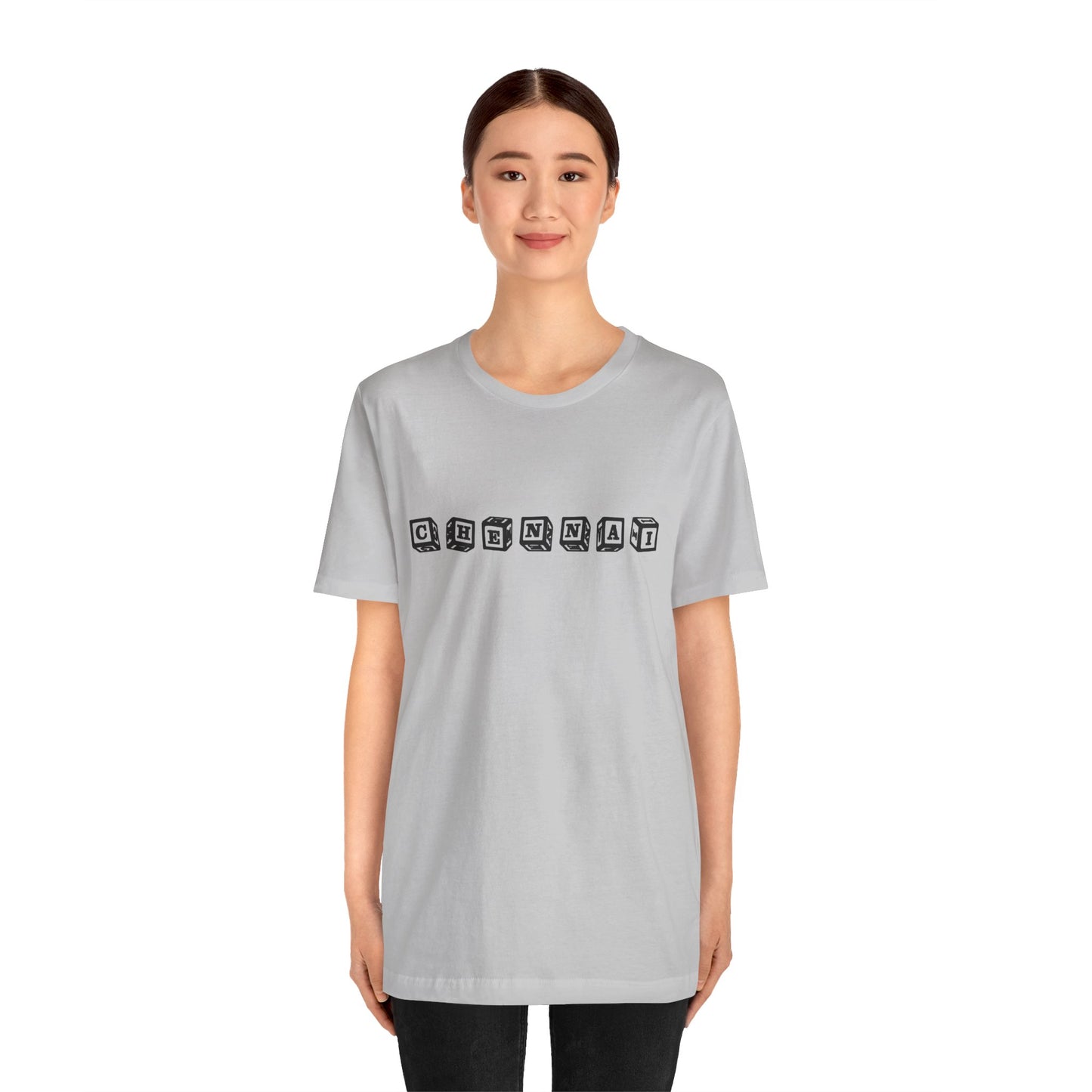 a woman wearing a solid athletic grey shirt that says chennai