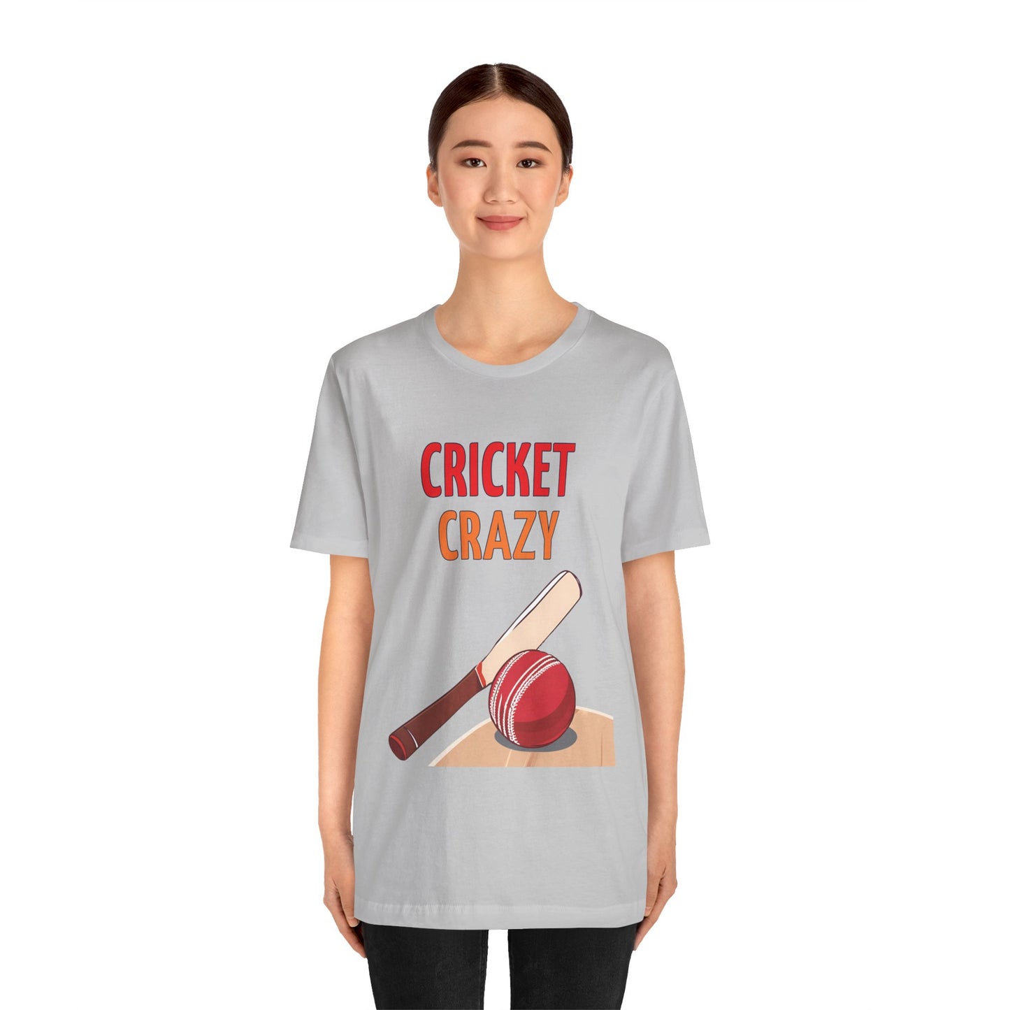 a woman wearing a solid athletic grey shirt that says cricket crazy with a graphic of a cricket bat and ball