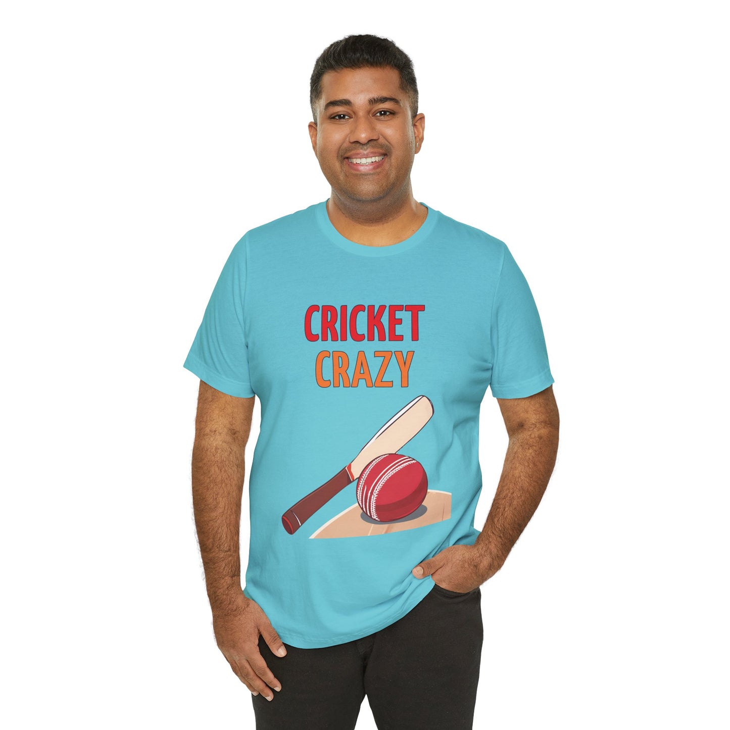 a man wearing a turquoise blue shirt that says cricket crazy with a graphic of a cricket bat and ball