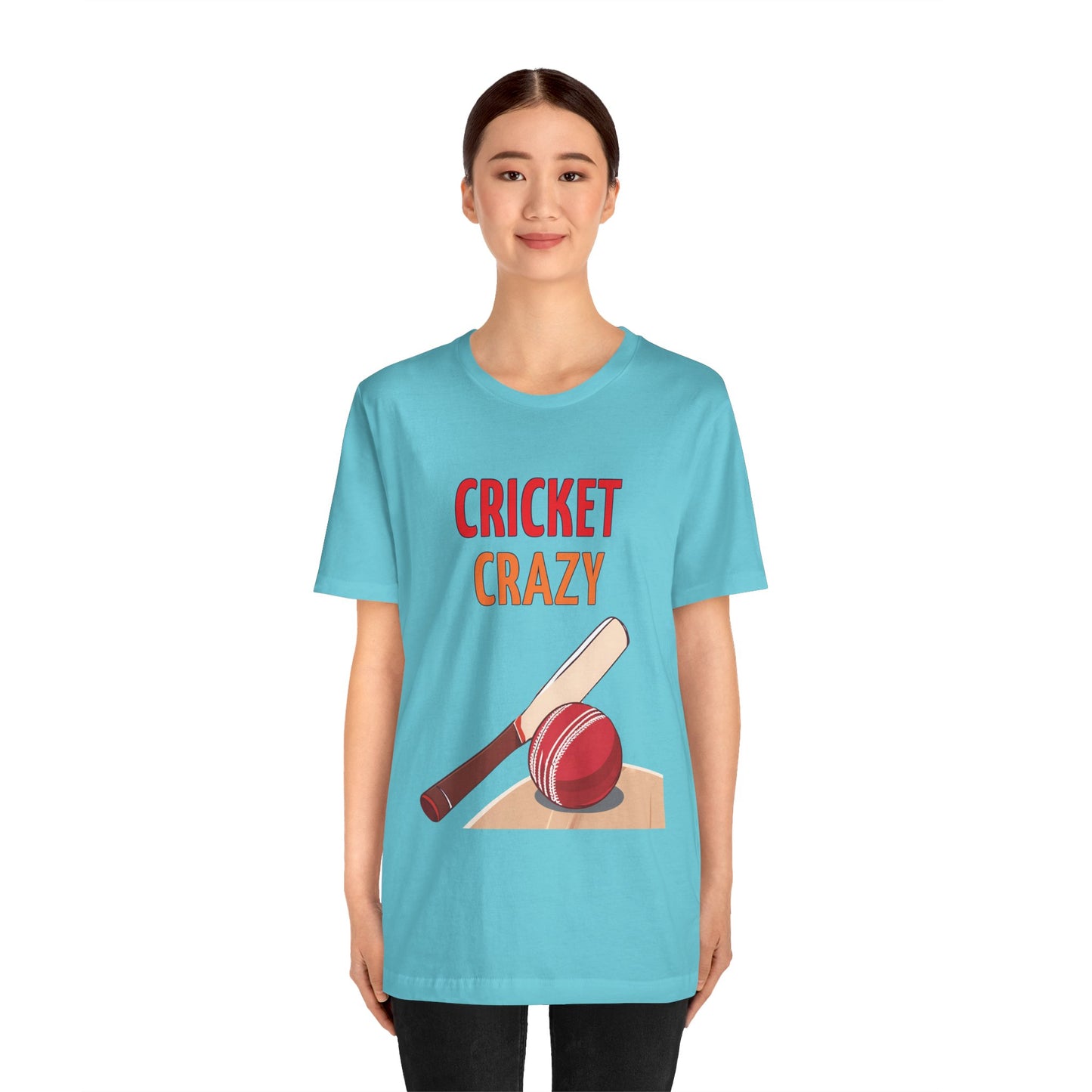 a woman wearing a turquoise blue shirt that says cricket crazy with a graphic of a cricket bat and ball
