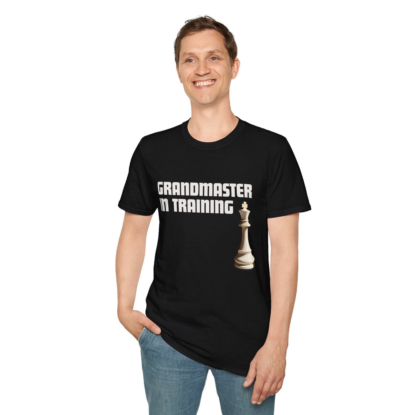 a man wearing a black shirt that says Grandmaster in Training with a King chess piece