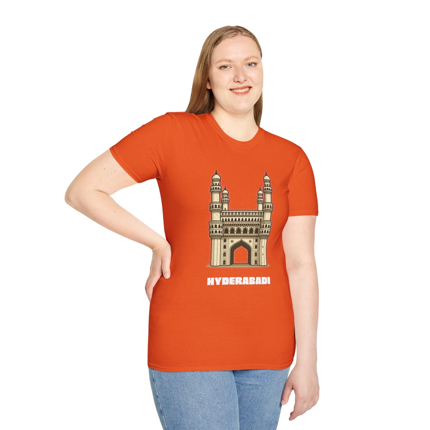 woman wearing a orange shirt that says Hyderabadi with a graphic of Charminar