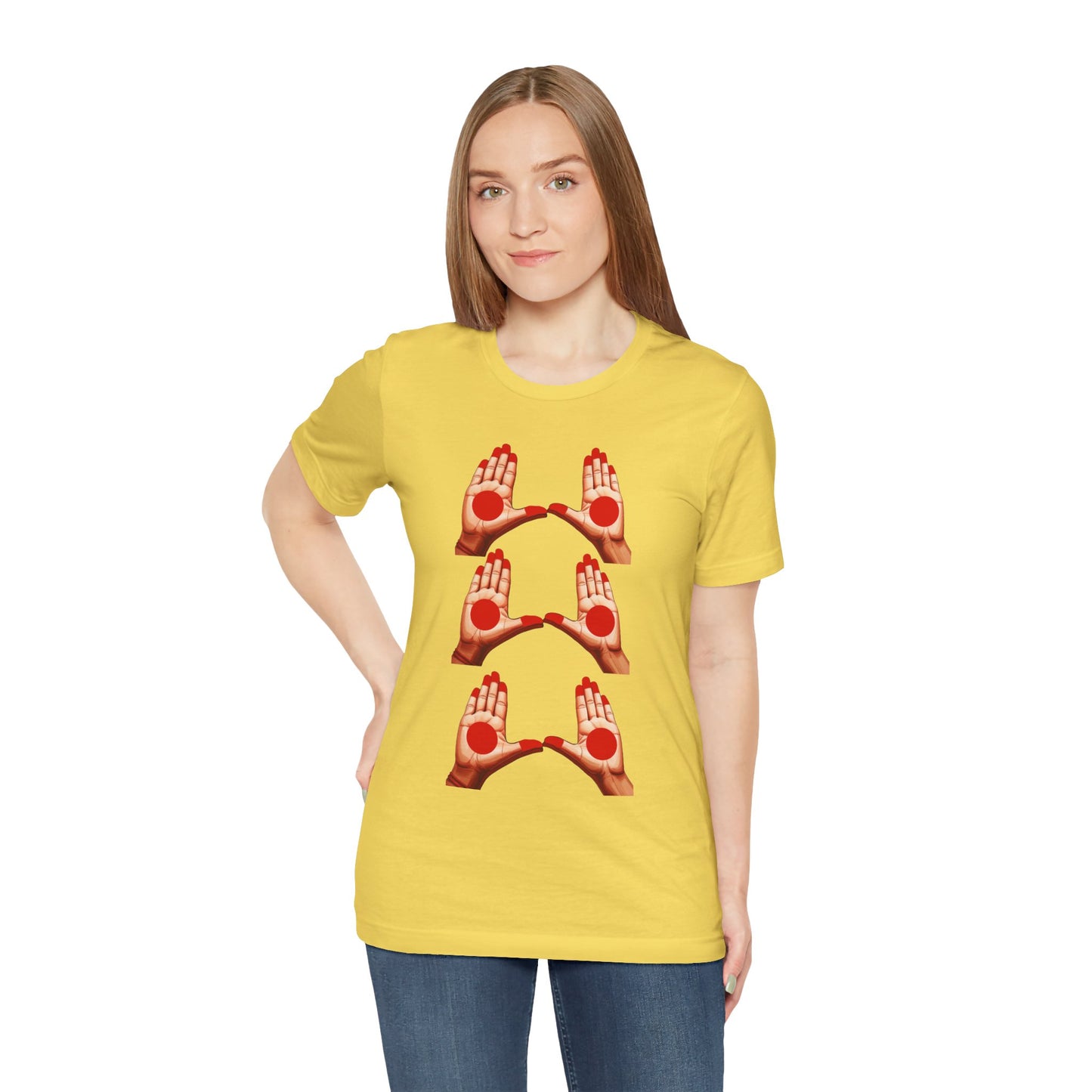 a woman wearing a maize yellow shirt that shows mudras