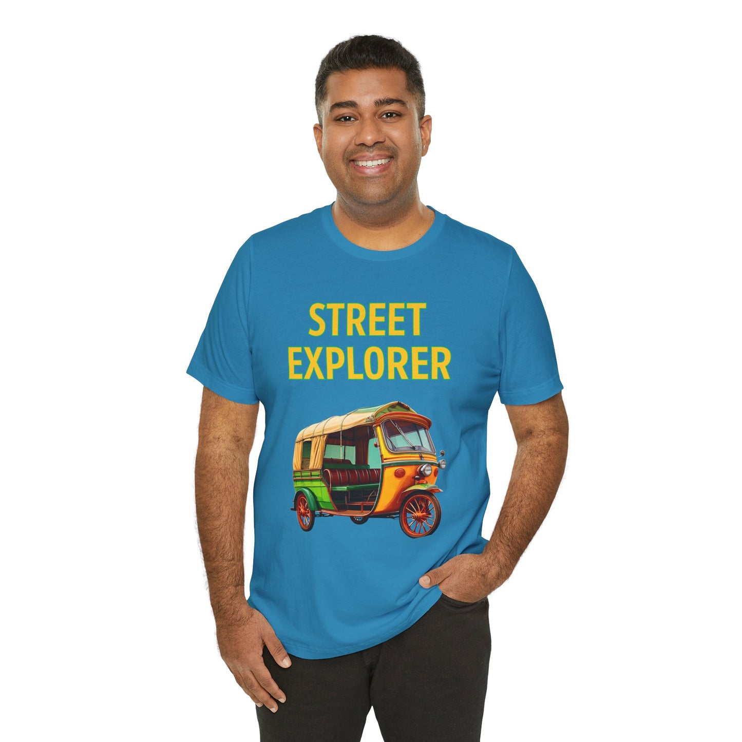 a man wearing a aqua blue shirt that says street explorer with a graphic of an auto rickshaw