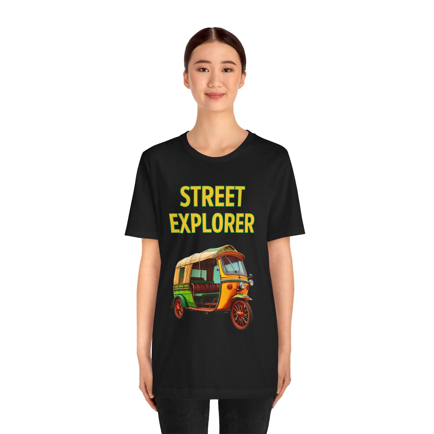 a woman wearing a black shirt that says street explorer with a graphic of an auto rickshaw