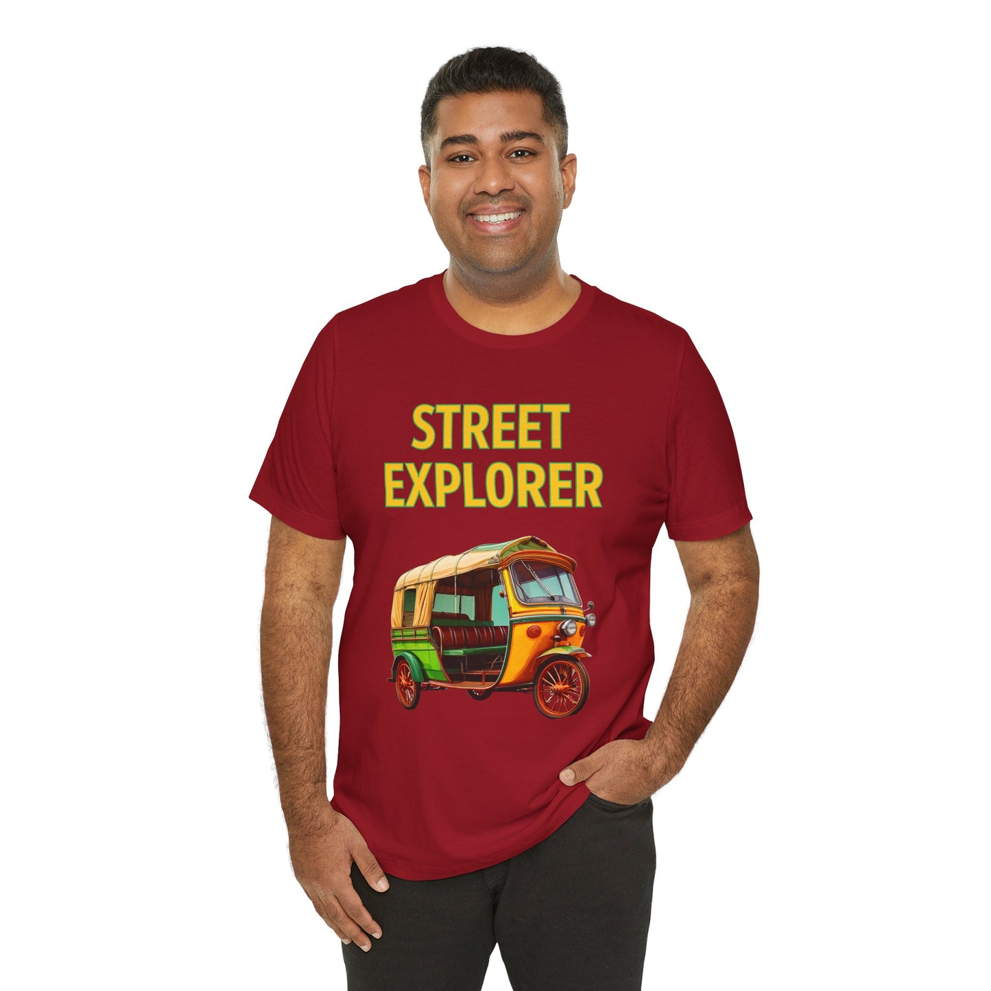 a man wearing a canvas red shirt that says street explorer with a graphic of an auto rickshaw