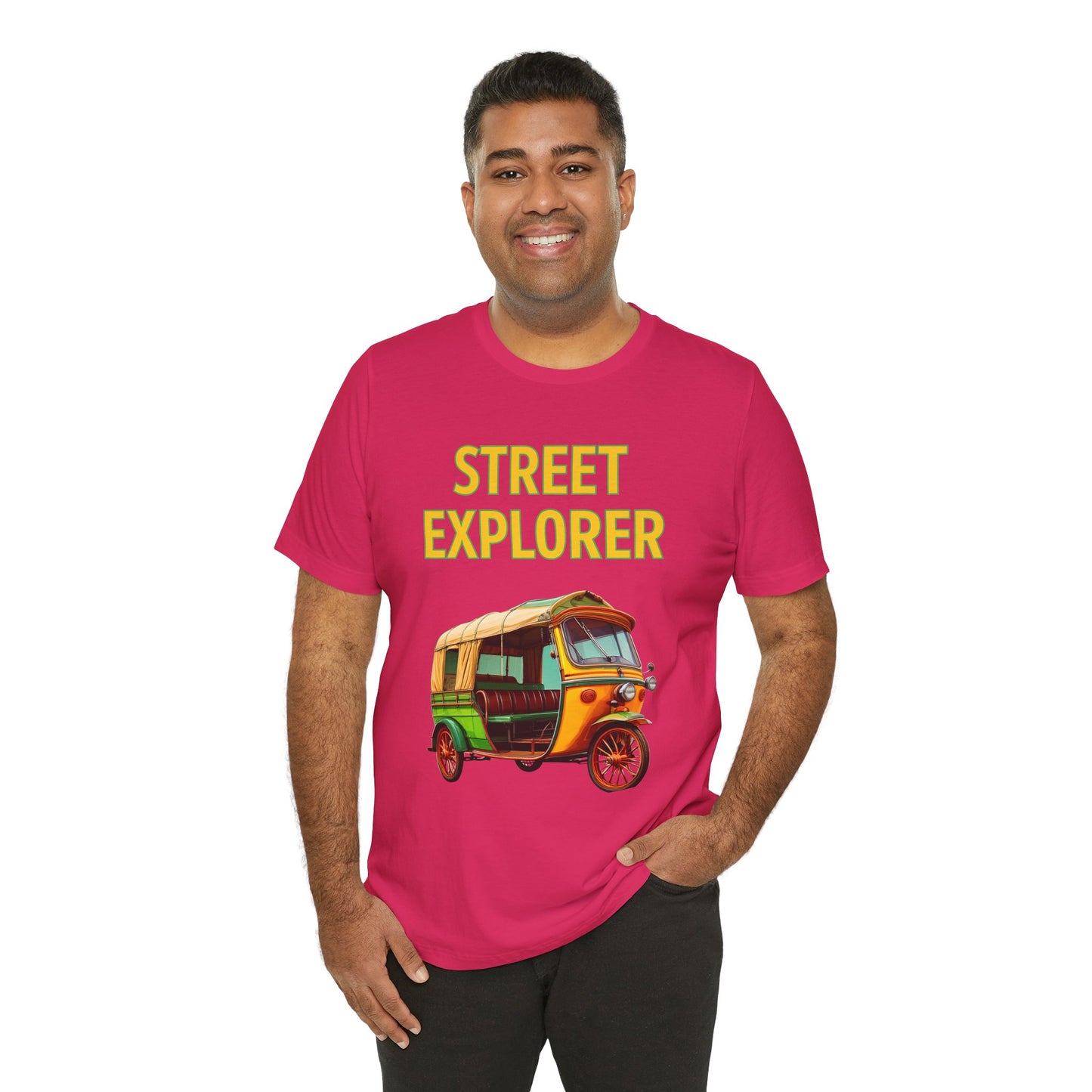a man wearing a fuchsia pink shirt that says street explorer with a graphic of an auto rickshaw