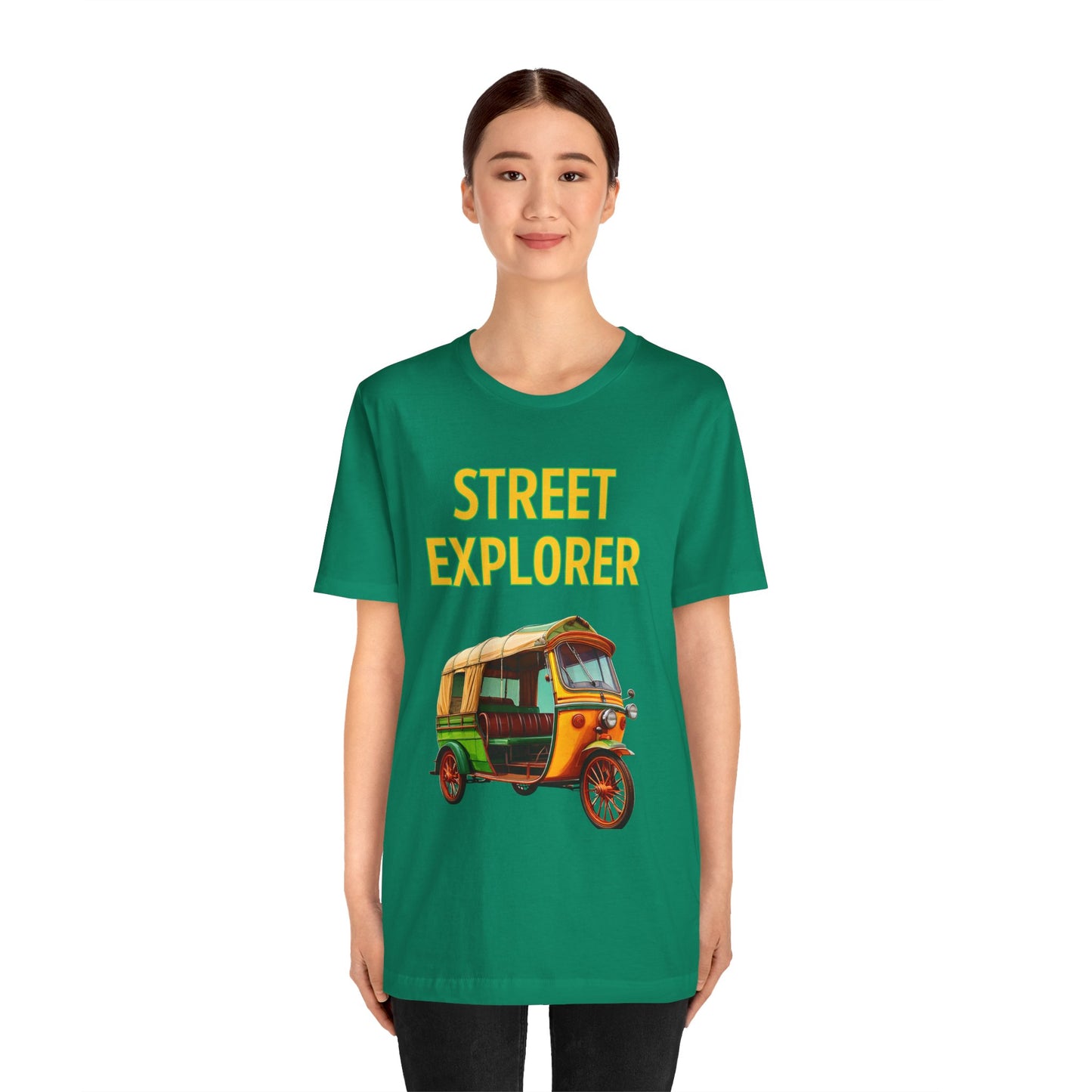 a woman wearing a kelly green shirt that says street explorer with a graphic of an auto rickshaw