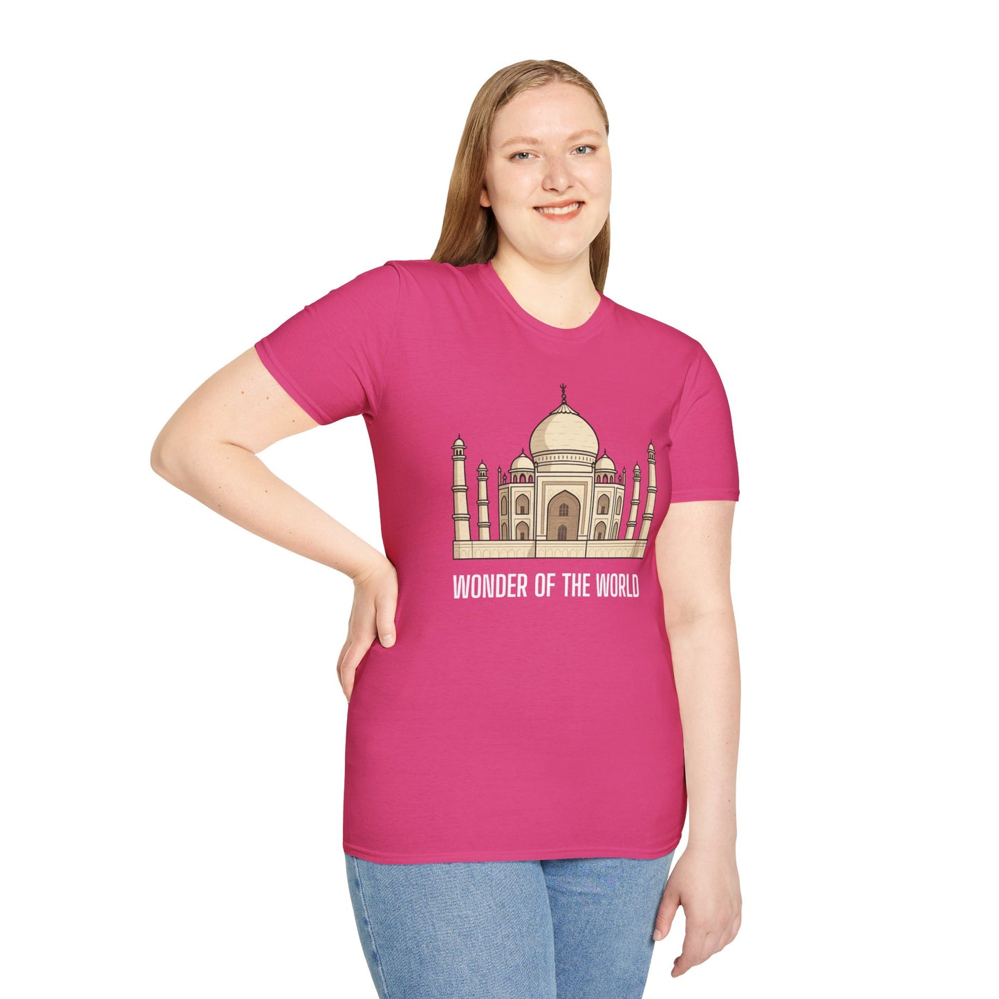 a woman wearing a heliconia pink shirt that says wonder of the world with a graphic of the taj mahal