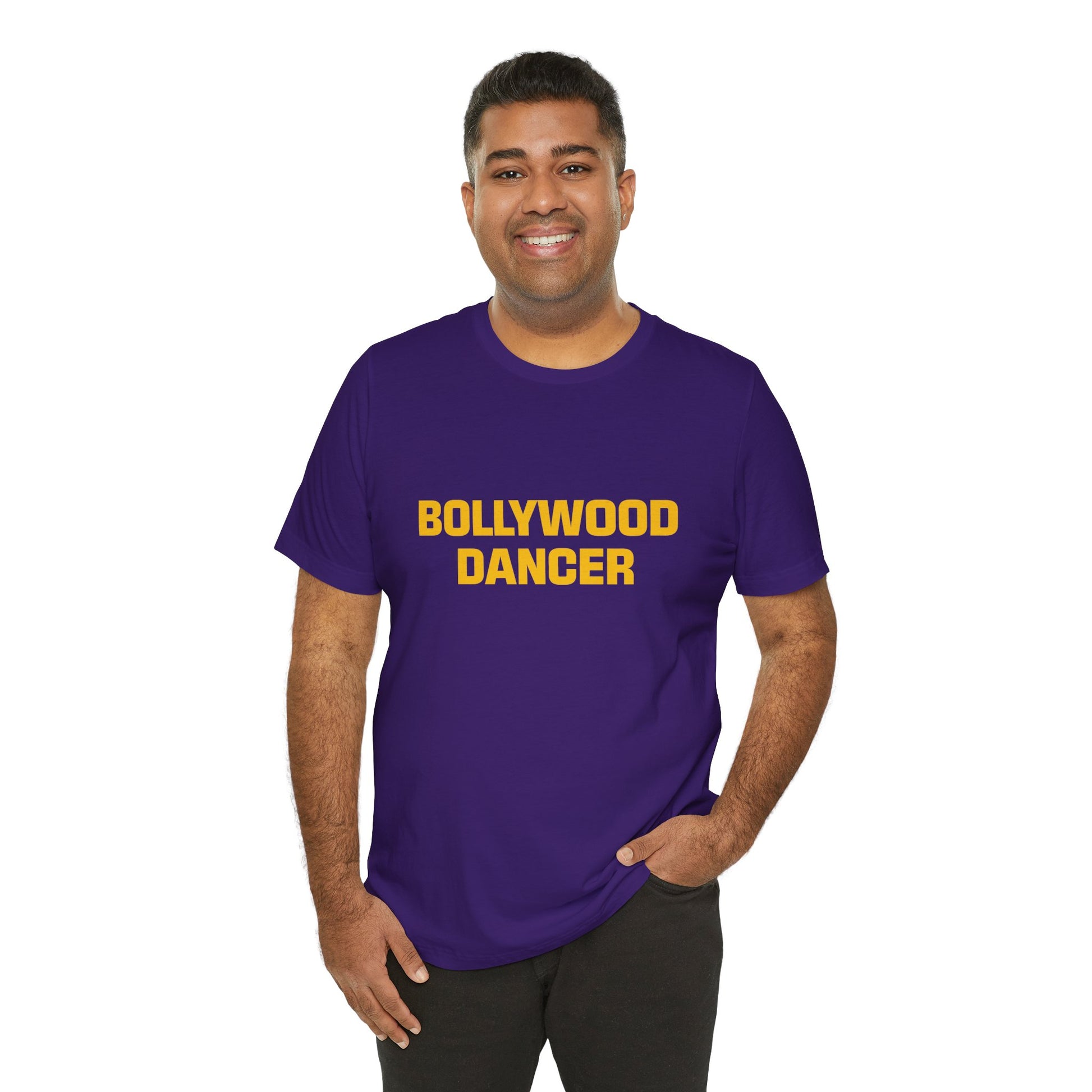man wearing a team purple shirt that says Bollywood Dancer