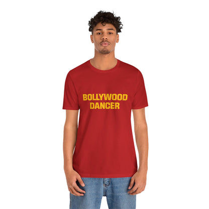 a man wearing a red shirt that says bollywood dancer