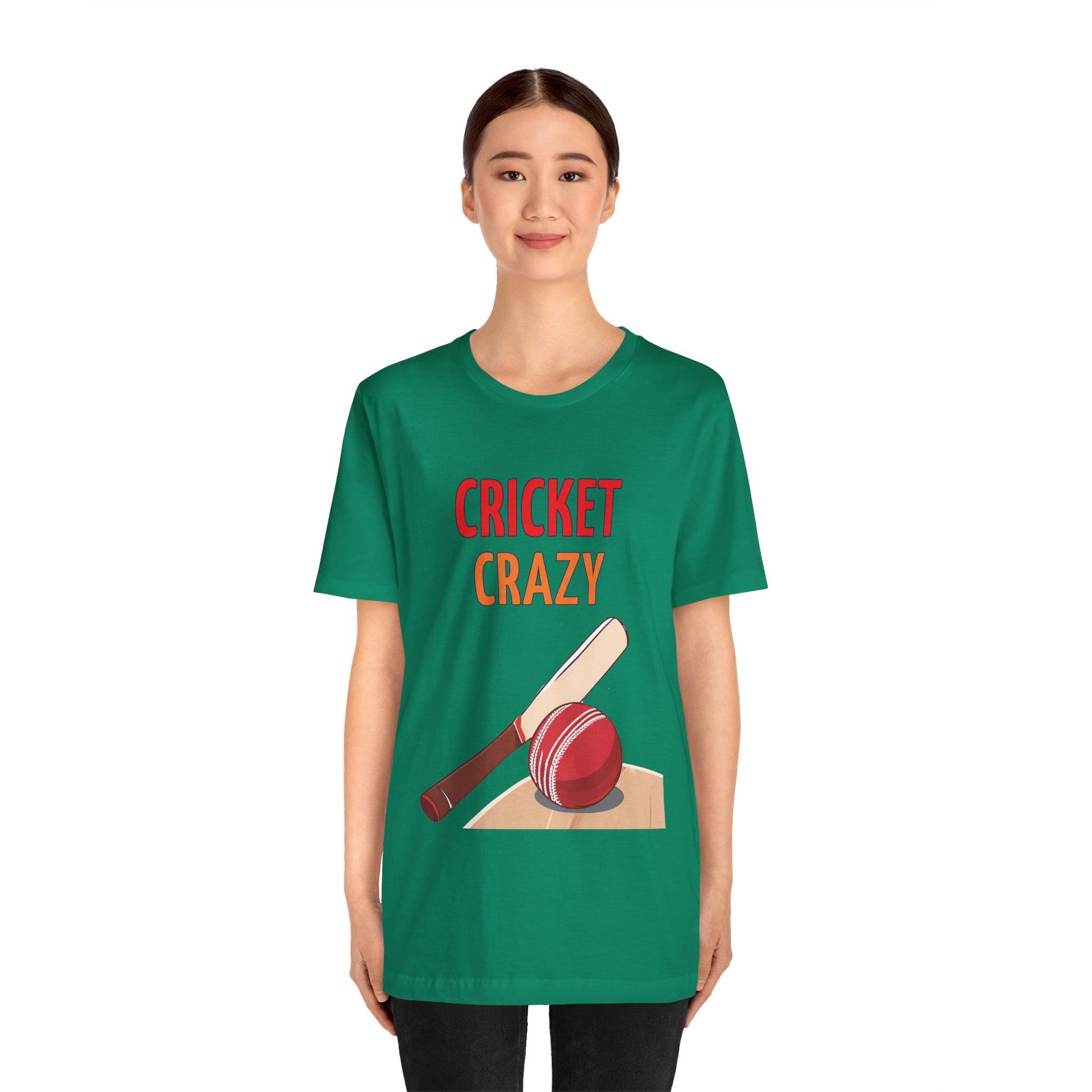 a woman wearing a kelly green shirt that says cricket crazy with a graphic of a cricket bat and ball