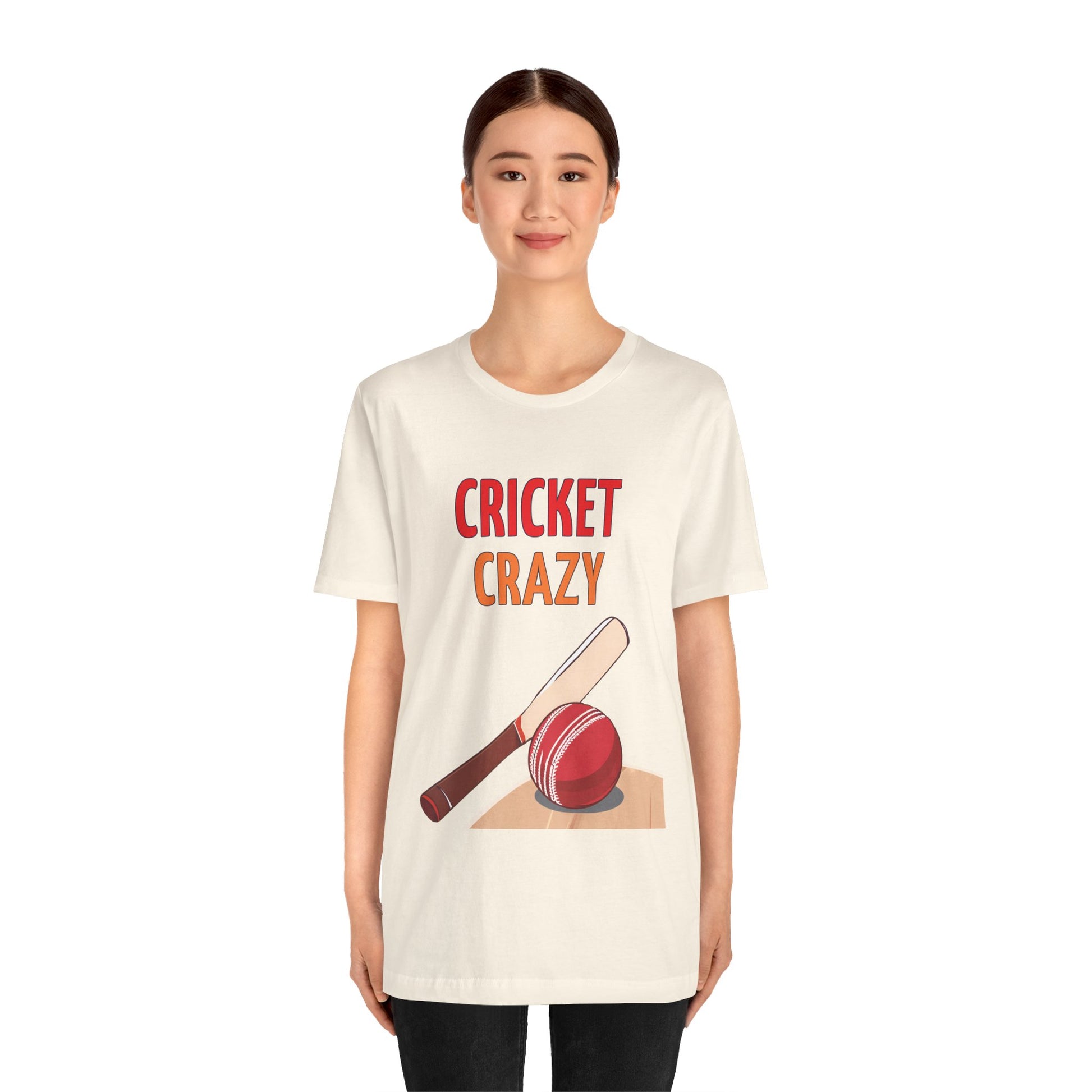 a woman wearing a natural shirt that says cricket crazy with a graphic of a cricket bat and ball