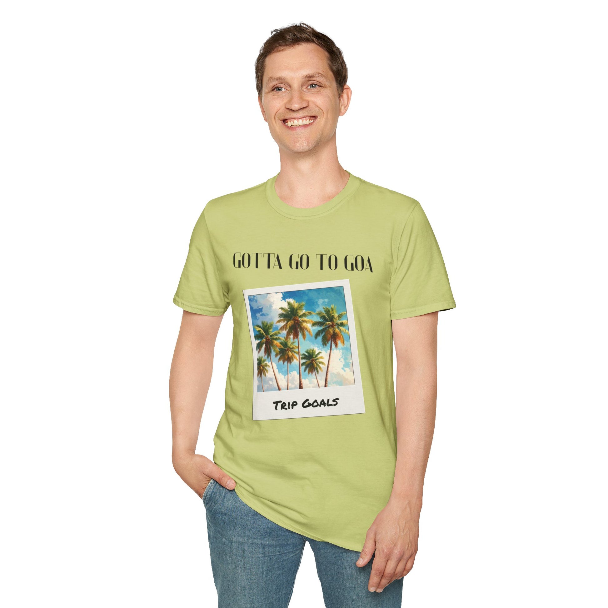 a man wearing a pistachio shirt that says gotta go to goa with a graphic of goa beach as a postcard that says trip goals
