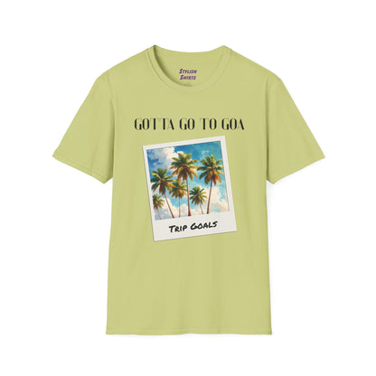 a pistachio shirt that says gotta go to goa with a graphic of goa beach as a postcard that says trip goals