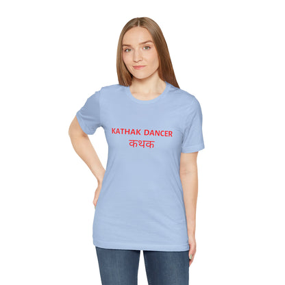 a woman wearing a baby blue shirt that says kathak dancer