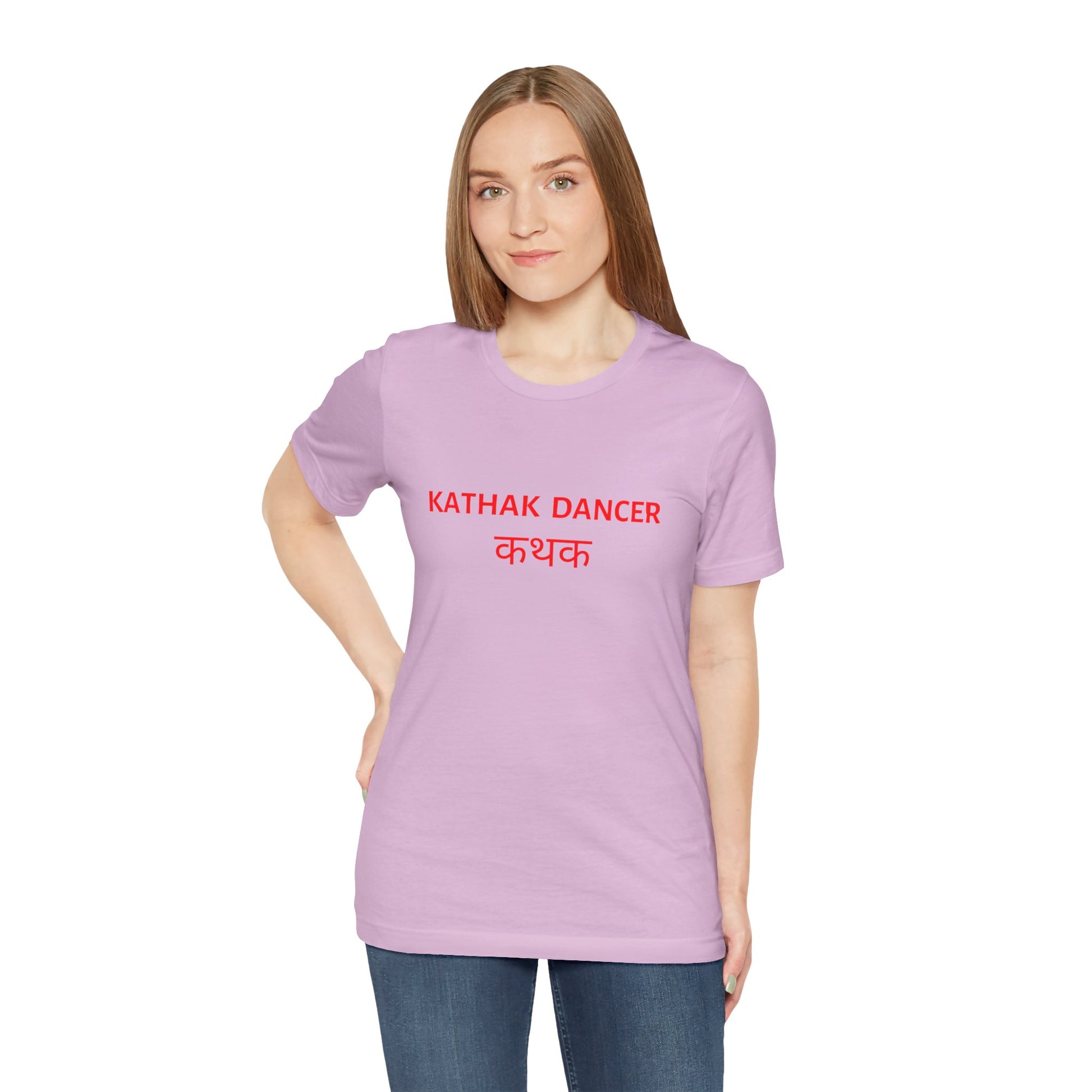 a woman wearing a lilac shirt that says kathak dancer