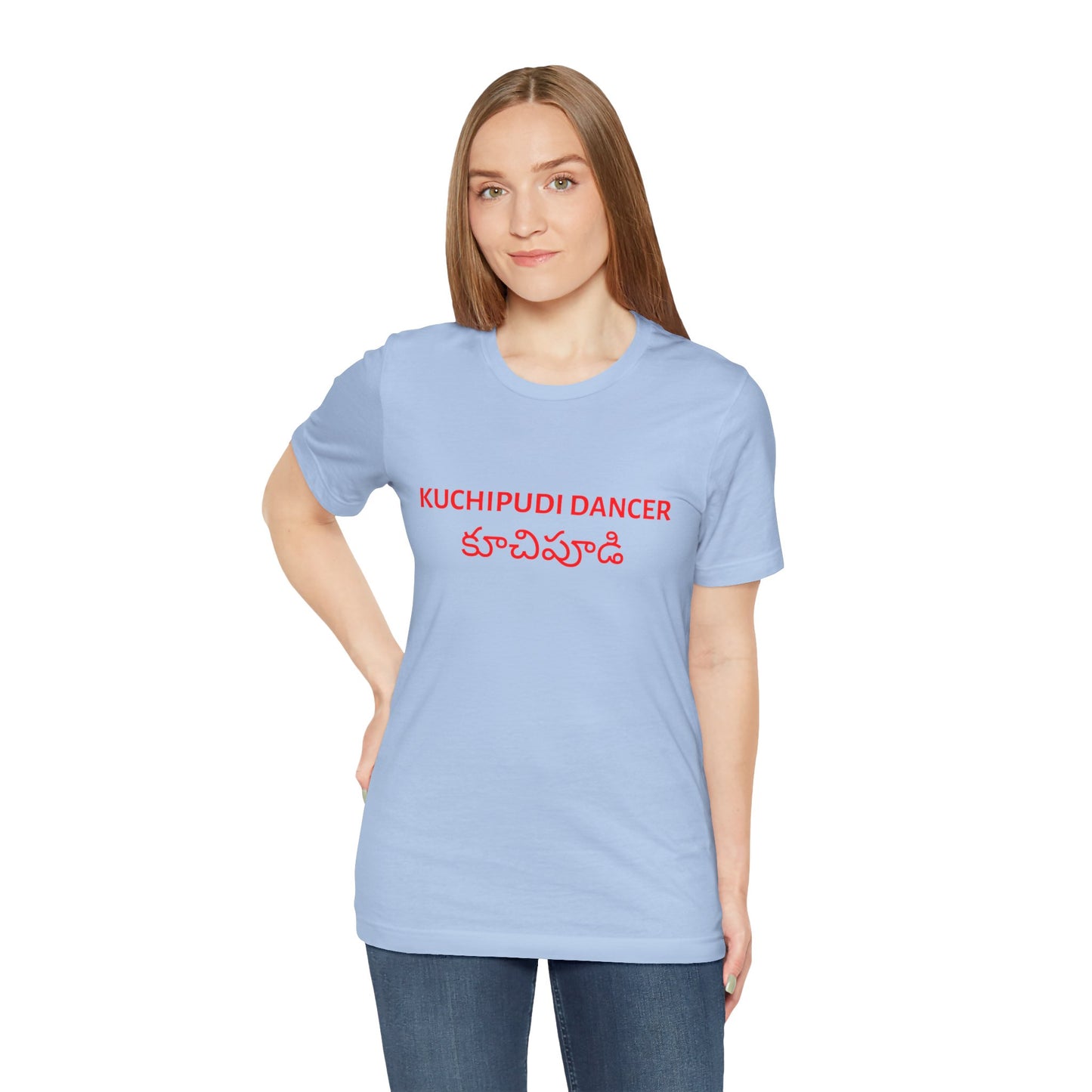a woman wearing a baby blue shirt that says kuchipudi dancer with kuchipudi also written in Telugu