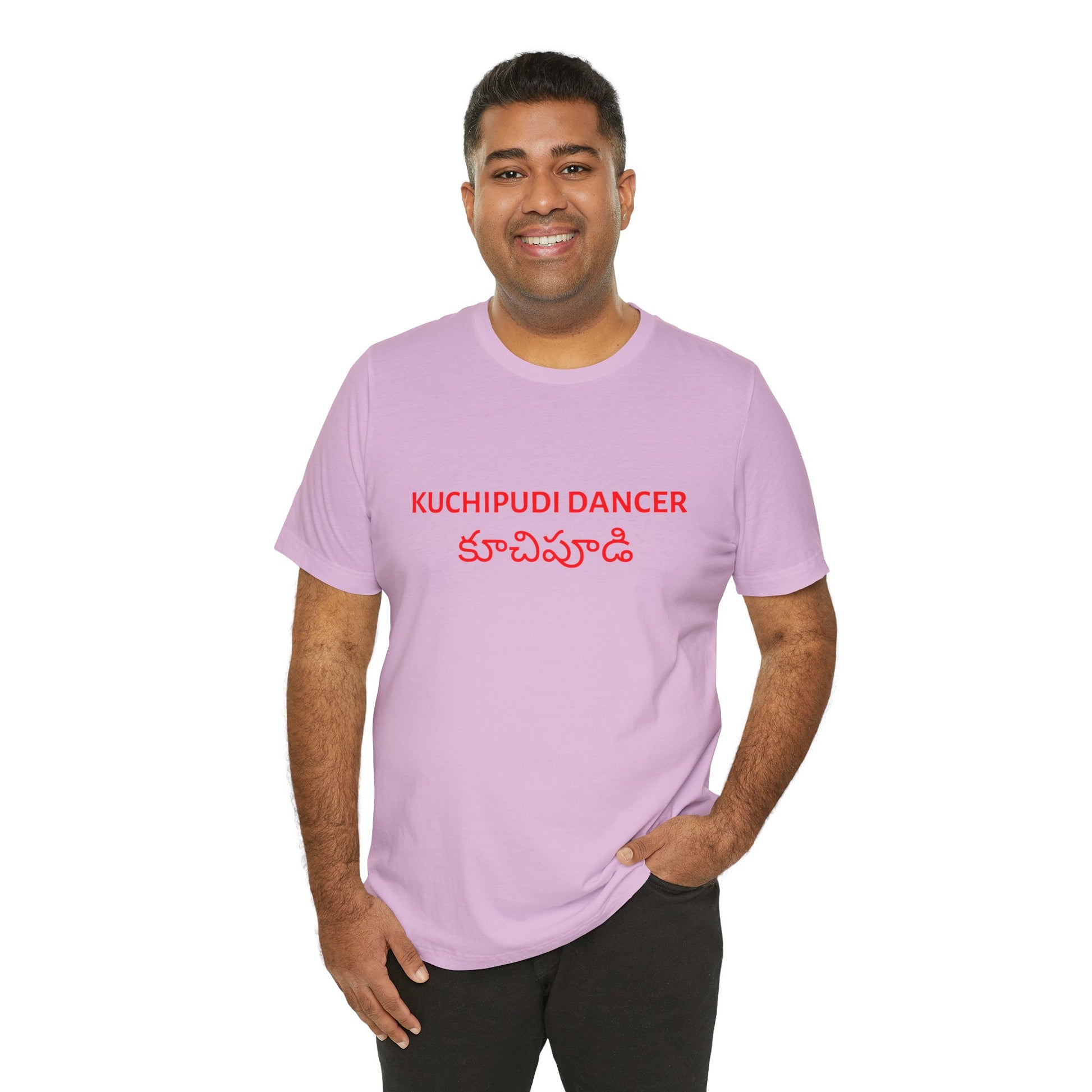 a man wearing a lilac shirt that says kuchipudi dancer with kuchipudi also written in Telugu