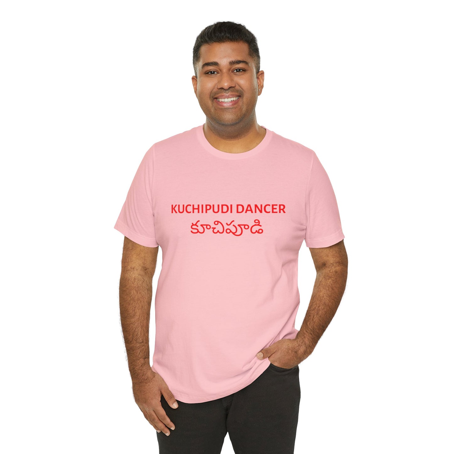 a man wearing a pink shirt that says kuchipudi dancer with kuchipudi also written in Telugu