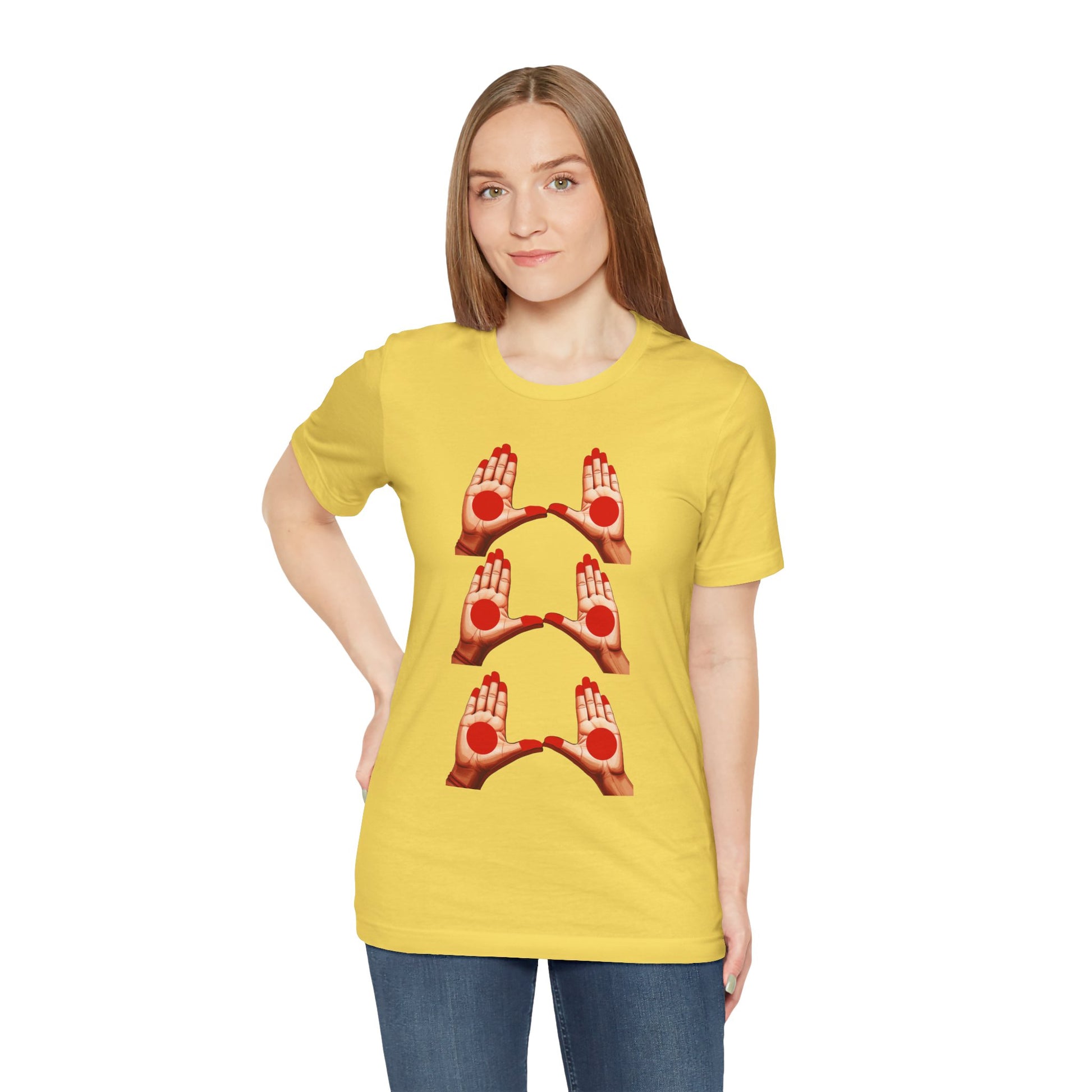 a woman wearing a maize yellow shirt that shows mudras