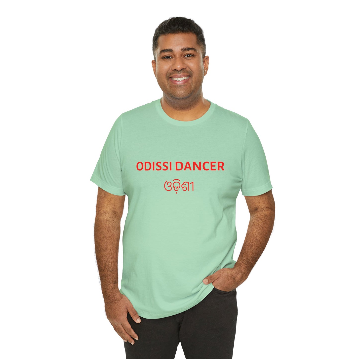 a man wearing a mint shirt that says Odissi dancer with Odissi also written in Odia