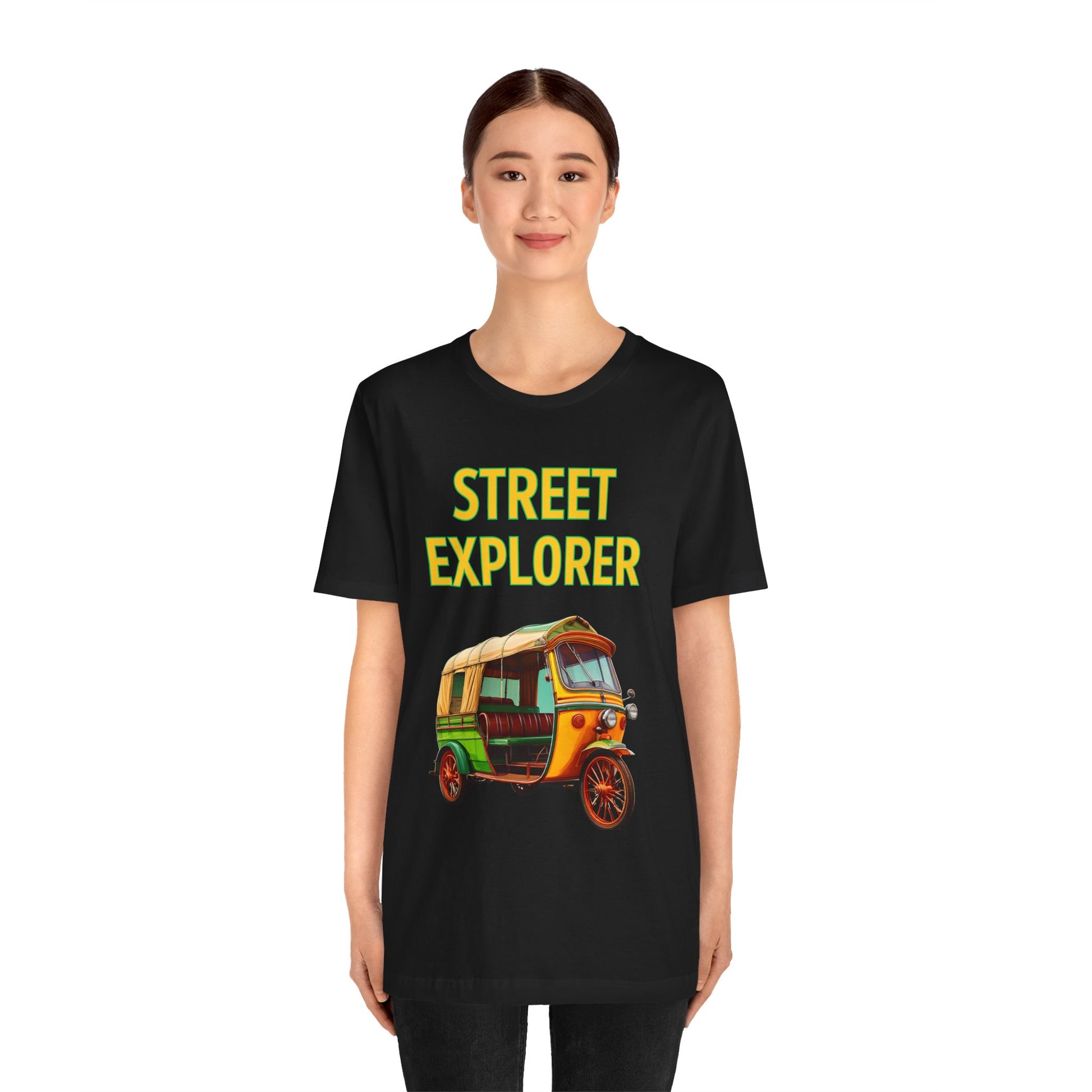 a woman wearing a black shirt that says street explorer with a graphic of an auto rickshaw